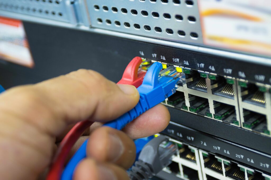 Network engineer plugging in ethernet cable - LucidLink