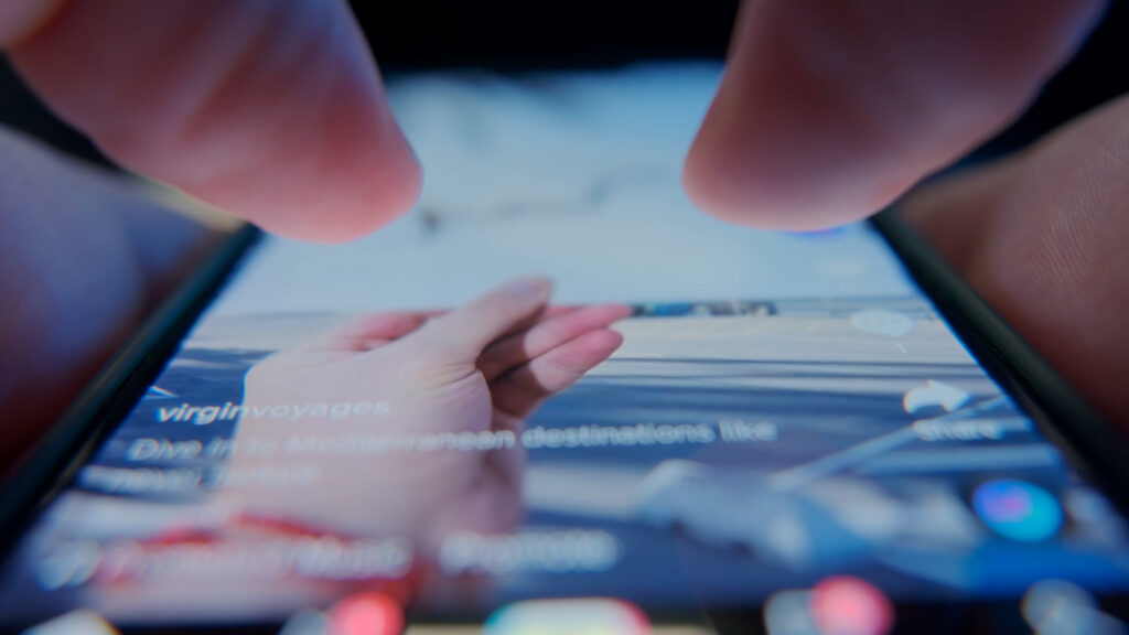 scrolling through phone showing the social media algorithms hungry for content